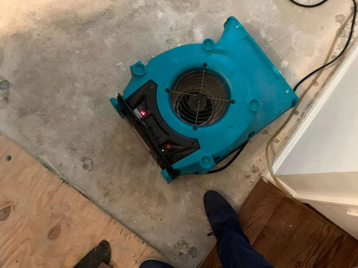 Air mover drying subfloor during Leak Detection & Repair in Sand Lake